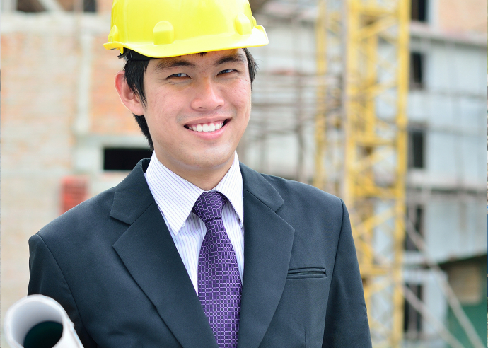 VTC 職業辭典「建築信息模擬工程師」配圖：工程師戴安全帽、手持圖則在工地